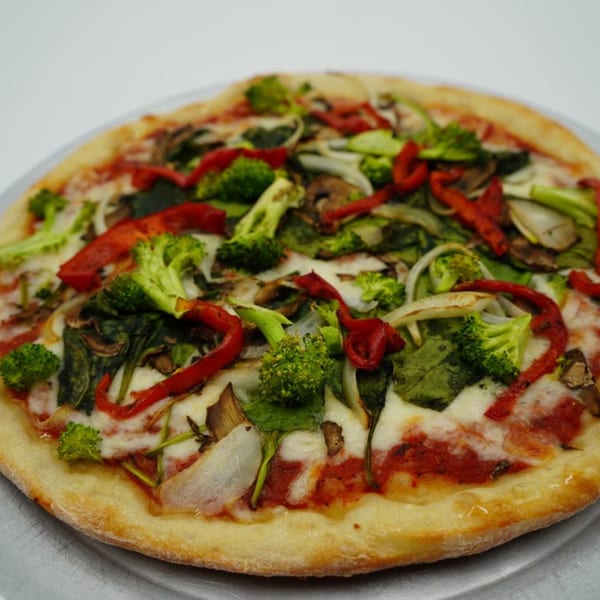Antonella's Pizzeria's vegetarian pizza with broccoli, red peppers, onions, spinach, and mushrooms.